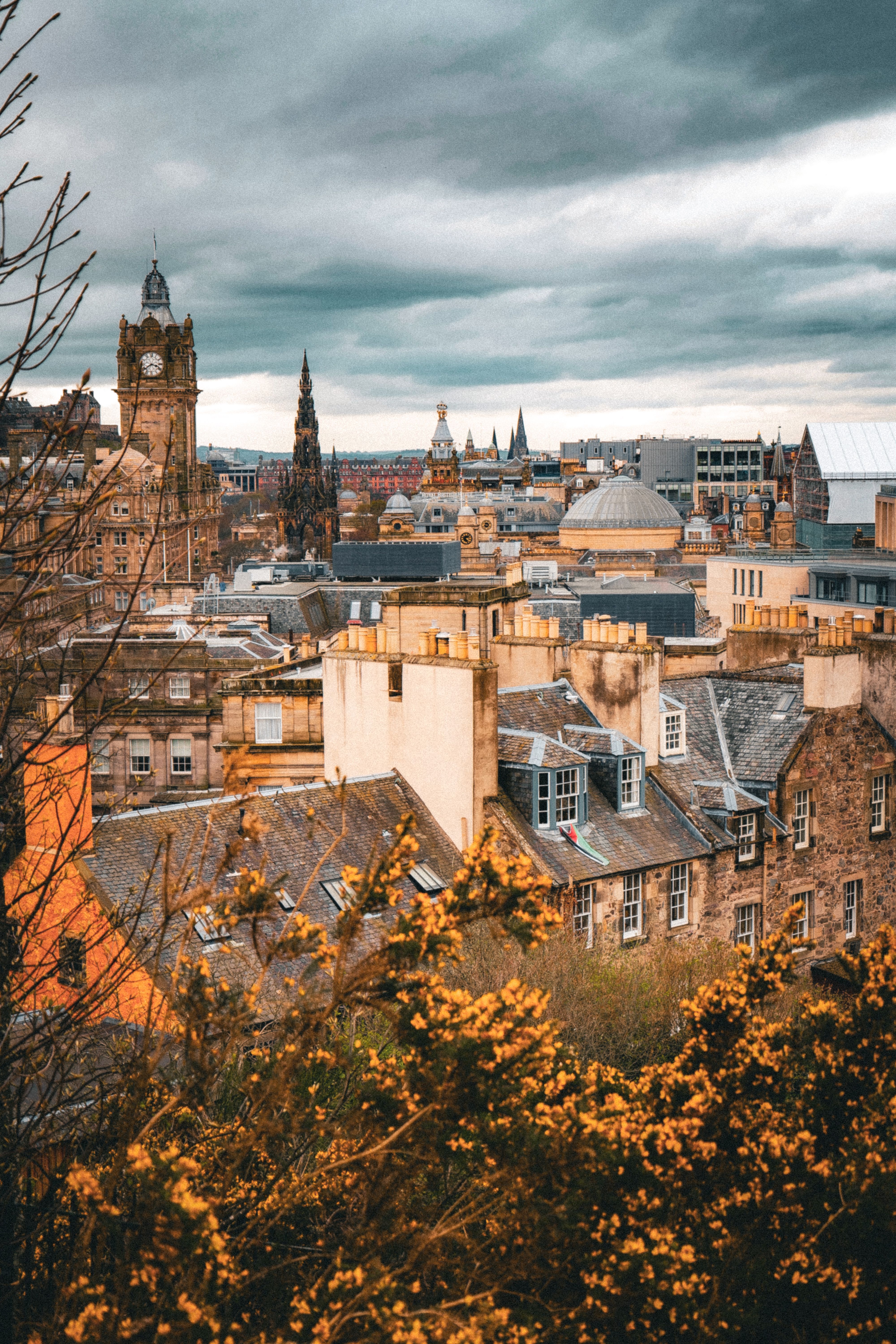 Overlook of Edinburgh with fall foilage and rolling clouds